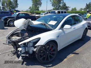 2020 Tesla Model 3 Performance z VIN 5YJ3E1EC6LF805448, wystawiony jako IAAI lot #42207433 z przebiegiem 114 412 mil mil oraz . Historia ofert i sprzedaży dostępna na DreamBid. Obrazek 2.