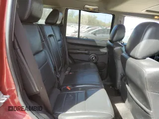 2010 Jeep Commander Sport z VIN 1J4RG4GK0AC156826, wystawiony jako Copart lot #50707345 z przebiegiem 213 694 mil mil oraz Szkoda całkowita • Salvage title. Historia ofert i sprzedaży dostępna na DreamBid. Obrazek 11.