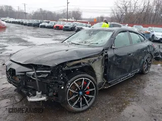 2024 BMW i4 M50 z VIN WBY33AW00RFS06591, wystawiony jako IAAI lot #41863252 z przebiegiem 15 260 mil mil oraz . Historia ofert i sprzedaży dostępna na DreamBid. Obrazek 21.