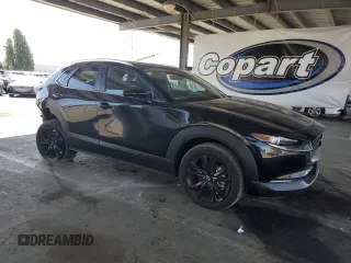 2024 Mazda CX-30 S Select Sport with VIN 3MVDMBBM8RM658675, listed as a Copart auction lot 61963635 with 8,497 mi miles and Salvage title. Bid and sale history available at DreamBid. Image 4.
