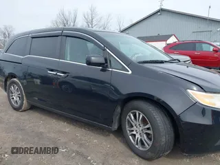 2012 Honda Odyssey EX-L with VIN 5FNRL5H63CB070361, listed as a IAAI auction lot 42025024 with 152,258 mi miles and . Bid and sale history available at carsss.com. Image 13.