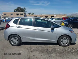2015 Honda Fit LX z VIN 3HGGK5H51FM750102, wystawiony jako IAAI lot #42278830 z przebiegiem 121 855 mil mil oraz . Historia ofert i sprzedaży dostępna na DreamBid. Obrazek 13.