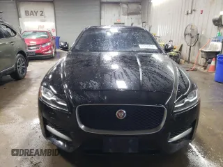 2017 Jaguar XF with VIN SAJBL4BV4HCY47941, listed as a Copart auction lot 77104404 with 73,839 mi miles and Salvage Title. Bid and sale history available at DreamBid. Image 5.