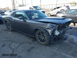 2021 Dodge Challenger GT with VIN 2C3CDZKG4MH677574, listed as a IAAI auction lot 41460036 with 67,170 mi miles. Bid and sale history available at carsss.com. Image 1.