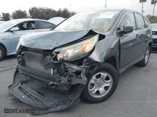 2015 Honda CR-V LX with VIN 3CZRM3H39FG706958, listed as a IAAI auction lot 41549880 with 85,567 mi miles. Bid and sale history available at carsss.com. Image 2.