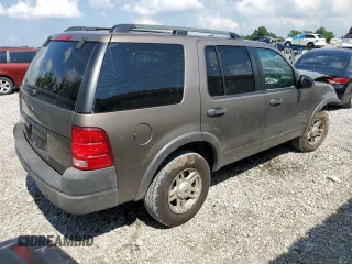 2003 Ford Explorer XLS with VIN 1FMZU72K43UB12036, listed as a Copart auction lot 61124985 with 210,901 mi miles and Salvage title. Bid and sale history available at DreamBid. Image 3.