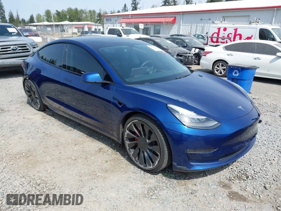 2021 Tesla Model 3 Performance with VIN 5YJ3E1EC1MF000961, listed as a IAAI auction lot 42110524 with 31,890 mi miles and . Bid and sale history available at carsss.com. Image 1.