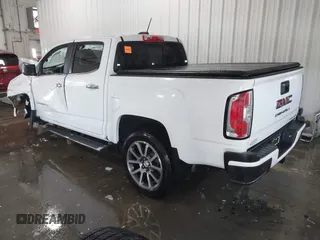 2021 GMC Canyon 4WD Denali with VIN 1GTG6EEN0M1229180, listed as a IAAI auction lot 41298304 with 55,865 mi miles. Bid and sale history available at carsss.com. Image 3.