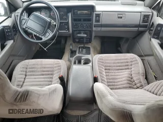 1995 Jeep Grand Cherokee Laredo z VIN 1J4GZ58S2SC578183, wystawiony jako Copart lot #61665955 z przebiegiem 341 135 mil mil oraz Szkoda całkowita • Salvage title. Historia ofert i sprzedaży dostępna na DreamBid. Obrazek 8.