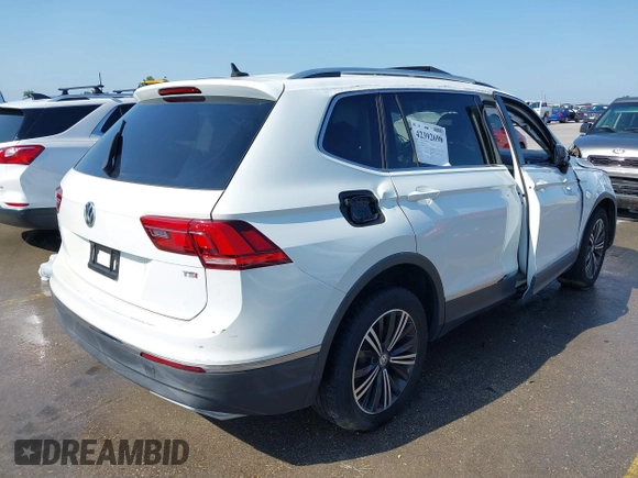 2018 Volkswagen Tiguan SEL z VIN 3VV3B7AX5JM091021, wystawiony jako IAAI lot #42392698 z przebiegiem 107 595 mil mil oraz . Historia ofert i sprzedaży dostępna na DreamBid. Obrazek 4.