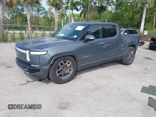 2022 Rivian R1T Launch Edition with VIN 7FCTGAAL9NN004060, listed as a IAAI auction lot 41637884 with 40,268 mi miles. Bid and sale history available at carsss.com. Image 2.