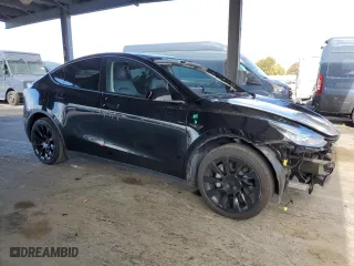 2022 Tesla Model Y Long Range with VIN 7SAYGDEE2NF402219, listed as a Copart auction lot 47405325 with 44,509 mi miles and Salvage Title. Bid and sale history available at carsss.com. Image 4.