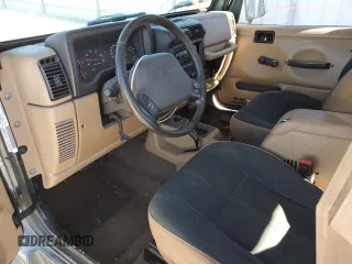 2002 Jeep Wrangler Sahara with VIN 1J4FA59S02P761365, listed as a Copart auction lot 81899144 with 208,429 mi miles and Salvage title. Bid and sale history available at DreamBid. Image 8.
