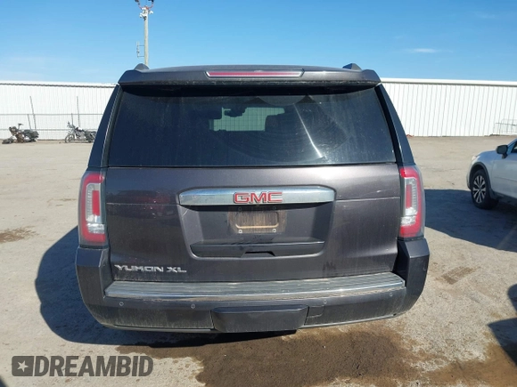 2015 GMC Yukon XL Denali with VIN 1GKS2JKJ9FR634771, listed as a IAAI auction lot 41676218 with 73,271 mi miles. Bid and sale history available at carsss.com. Image 16.