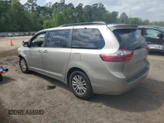 2016 Toyota Sienna XLE with VIN 5TDYK3DC0GS697468, listed as a Copart auction lot 51186795 with 128,851 mi miles and Salvage Title. Bid and sale history available at DreamBid. Image 2.