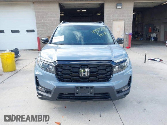 2023 Honda Passport Elite with VIN 5FNYF8H03PB000039, listed as a IAAI auction lot 40593339 with 33,697 mi miles and . Bid and sale history available at DreamBid. Image 12.