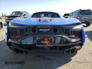 2023 McLaren Artura z VIN SBM16AEA9PW001592, wystawiony jako Copart lot #50613595 z przebiegiem 2956 mil mil oraz Szkody całkowita. Historia ofert i sprzedaży dostępna na DreamBid. Obrazek 6.