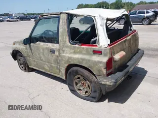 1995 Chevrolet Tracker z VIN 2CNBJ1869S6911342, wystawiony jako IAAI lot #42265392 z przebiegiem 121 944 mil mil oraz . Historia ofert i sprzedaży dostępna na DreamBid. Obrazek 3.