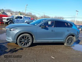 2021 Mazda CX-9 Grand Touring with VIN JM3TCBDY5M0506632, listed as a IAAI auction lot 41589264 with 50,026 mi miles and . Bid and sale history available at carsss.com. Image 14.