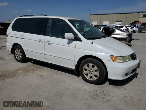 2004 Honda Odyssey EX-L with VIN 5FNRL18974B092979, listed as a Copart auction lot 52429055 with 106,515 mi miles and Clean Title. Bid and sale history available at DreamBid. Image 4.