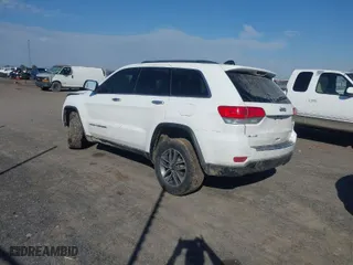2019 Jeep Grand Cherokee Limited with VIN 1C4RJFBG3KC734697, listed as a IAAI auction lot 41645913 with 128,419 mi miles. Bid and sale history available at carsss.com. Image 3.