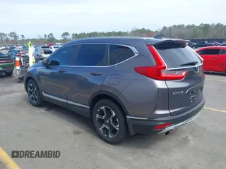 2018 Honda CR-V Touring with VIN 7FARW1H9XJE018575, listed as a IAAI auction lot 41747192 with 83,699 mi miles and . Bid and sale history available at carsss.com. Image 3.