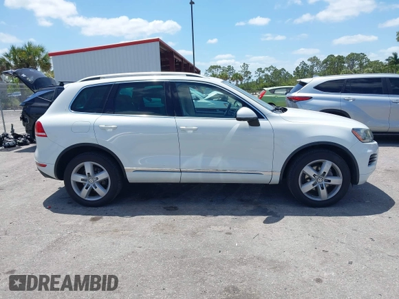 2012 Volkswagen Touareg Sport with VIN WVGEF9BP1CD008717, listed as a IAAI auction lot 42120641 with 211,580 mi miles and . Bid and sale history available at DreamBid. Image 13.