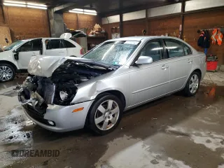 2008 Kia Optima LX z VIN KNAGE123685263764, wystawiony jako Copart lot #57772045 z przebiegiem 106 751 mil mil oraz Szkoda całkowita • Salvage title. Historia ofert i sprzedaży dostępna na DreamBid. Obrazek 1.