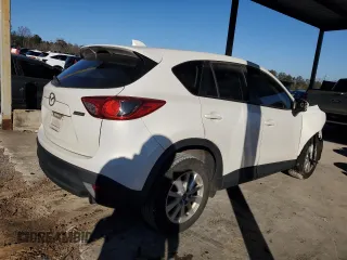 2014 Mazda CX-5 Sport with VIN JM3KE2BEXE0332590, listed as a Copart auction lot 87534365 with Not Provided miles and Salvage Title. Bid and sale history available at carsss.com. Image 3.