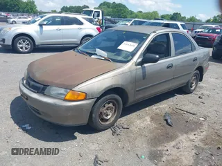 1997 Mazda Protege DX with VIN JM1BC1416V0132633, listed as a IAAI auction lot 42162630 with 234,300 mi miles and . Bid and sale history available at DreamBid. Image 2.