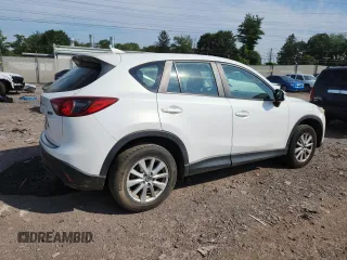 2016 Mazda CX-5 Sport with VIN JM3KE4BYXG0704194, listed as a Copart auction lot 62095735 with 93,970 mi miles and Salvage title. Bid and sale history available at DreamBid. Image 3.