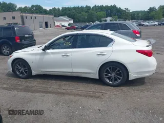 2015 Infiniti Q50 Premium with VIN JN1BV7AR5FM390985, listed as a IAAI auction lot 42641031 with 117,060 mi miles and . Bid and sale history available at DreamBid. Image 14.