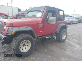 2000 Jeep Wrangler Sport with VIN 1J4FA49S2YP764321, listed as a IAAI auction lot 42385965 with Not provided miles and . Bid and sale history available at DreamBid. Image 2.