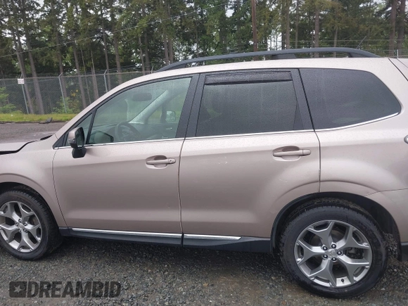2015 Subaru Forester Touring with VIN JF2SJAUC1FH457069, listed as a IAAI auction lot 42293542 with 71,689 mi miles and . Bid and sale history available at DreamBid. Image 14.