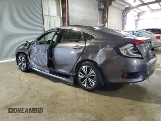 2017 Honda Civic EX-T with VIN 19XFC1E33HE002225, listed as a Copart auction lot 79443224 with 138,738 mi miles and Salvage Title. Bid and sale history available at DreamBid. Image 2.