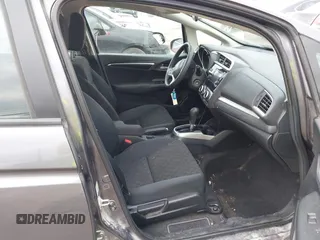 2015 Honda Fit LX with VIN 3HGGK5H58FM722880, listed as a IAAI auction lot 42276261 with 104,886 mi miles and . Bid and sale history available at DreamBid. Image 5.