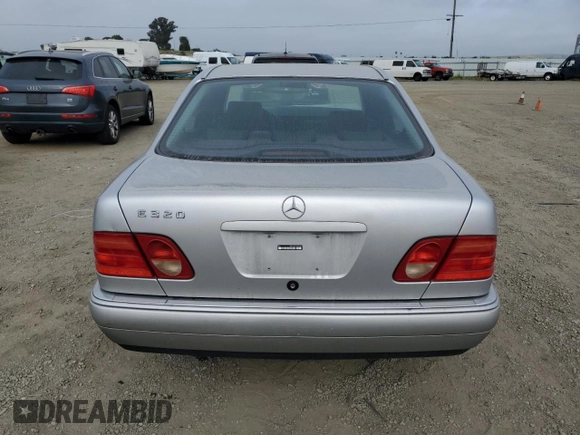 1999 Mercedes-Benz E-Class with VIN WDBJF65H0XA797390, listed as a Copart auction lot 55081405 with 80,950 mi miles and Salvage Title. Bid and sale history available at carsss.com. Image 6.