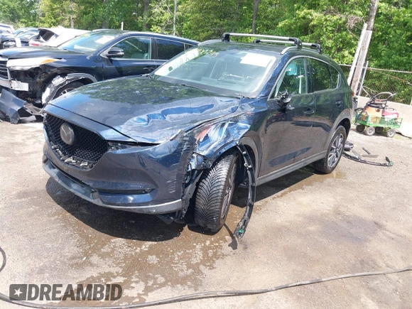 2018 Mazda CX-5 Grand Touring with VIN JM3KFBDM2J0373386, listed as a IAAI auction lot 42200795 with 70,111 mi miles and . Bid and sale history available at DreamBid. Image 18.
