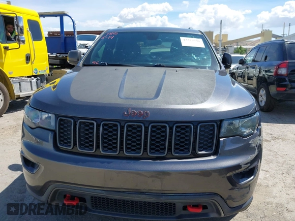 2017 Jeep Grand Cherokee Trailhawk with VIN 1C4RJFLG3HC877110, listed as a IAAI auction lot 42276506 with 144,993 mi miles and . Bid and sale history available at DreamBid. Image 13.