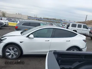 2022 Tesla Model Y Long Range z VIN 7SAYGDEE7NF389788, wystawiony jako IAAI lot #42014111 z przebiegiem 37 606 mil mil oraz . Historia ofert i sprzedaży dostępna na DreamBid. Obrazek 13.