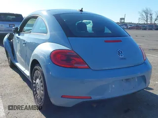 2014 Volkswagen Beetle 2.5L w/Sun with VIN 3VWJP7AT6EM601318, listed as a IAAI auction lot 41902598 with 169,220 mi miles and . Bid and sale history available at DreamBid. Image 3.
