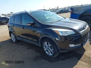 2015 Ford Escape Titanium with VIN 1FMCU0J9XFUA17805, listed as a IAAI auction lot 39518493 with 156,288 mi miles and . Bid and sale history available at DreamBid. Image 1.