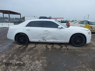 2014 Chrysler 300 with VIN 2C3CCAAG2EH235495, listed as a IAAI auction lot 41787801 with 142,354 mi miles and . Bid and sale history available at DreamBid. Image 13.