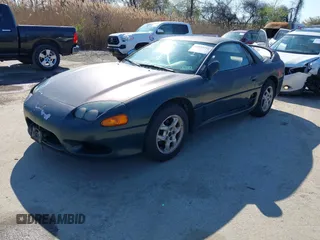 1997 Mitsubishi 3000GT z VIN JA3AM44H8VY001162, wystawiony jako IAAI lot #41933754 z przebiegiem 157 314 mil mil oraz . Historia ofert i sprzedaży dostępna na DreamBid. Obrazek 2.