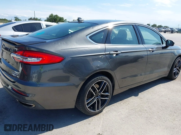 2019 Ford Fusion Titanium with VIN 3FA6P0D91KR104827, listed as a IAAI auction lot 42221526 with 141,316 mi miles and . Bid and sale history available at DreamBid. Image 4.
