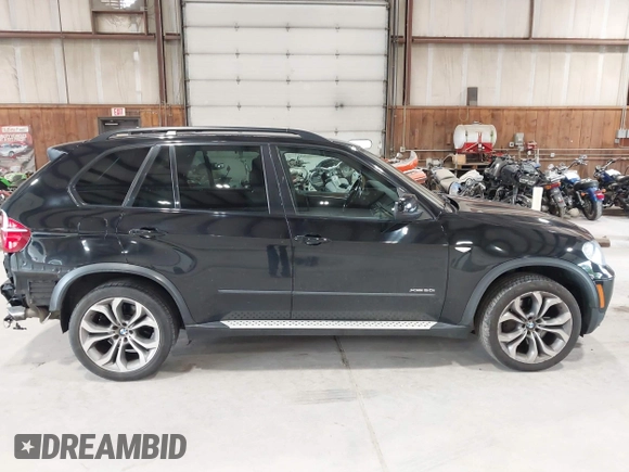 2012 BMW X5 50i with VIN 5UXZV8C50CL425721, listed as a IAAI auction lot 42590676 with 192,355 mi miles and . Bid and sale history available at DreamBid. Image 13.