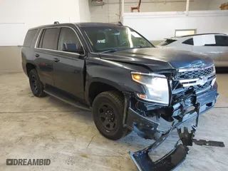 2017 Chevrolet Tahoe Commercial with VIN 1GNLCDECXHR228908, listed as a IAAI auction lot 41537030 with 114,725 mi miles. Bid and sale history available at carsss.com. Image 1.