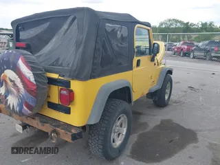 2005 Jeep Wrangler SE z VIN 1J4FA29S95P373313, wystawiony jako IAAI lot #42340611 z przebiegiem 162 801 mil mil oraz . Historia ofert i sprzedaży dostępna na DreamBid. Obrazek 4.