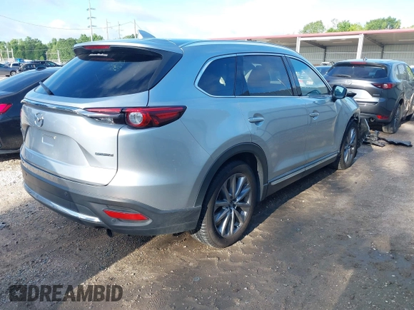 2020 Mazda CX-9 Grand Touring with VIN JM3TCADY2L0406173, listed as a IAAI auction lot 42217230 with 110,465 mi miles and . Bid and sale history available at DreamBid. Image 4.