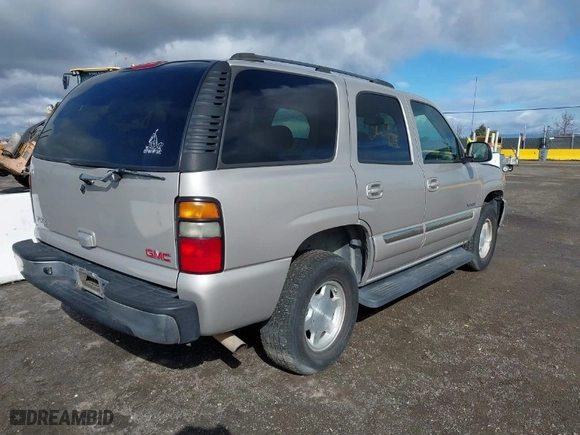 2004 GMC Yukon SLT with VIN 1GKEC13V74J311617, listed as a IAAI auction lot 41785561 with 225,245 mi miles. Bid and sale history available at carsss.com. Image 4.